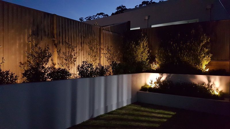 Outdoor deck and fence lighting at night